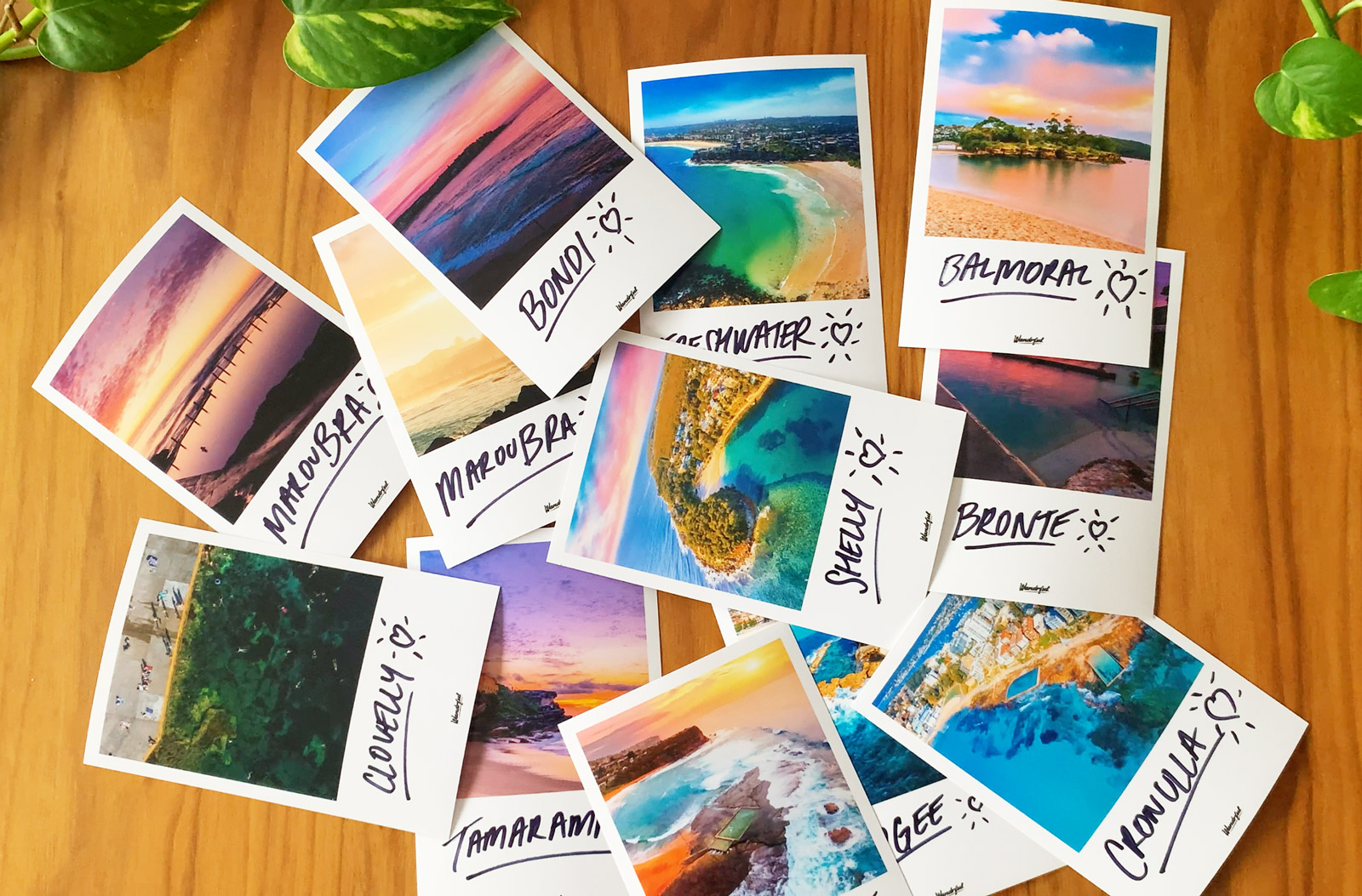 Wandrful Beach Towels. Beach polaroid photos on table.