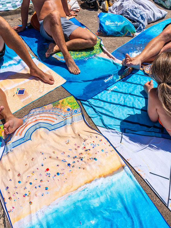 Group of friends enjoying a Summers Day in Bondi Beach, lying on Wandrful sand-free, beach towels.